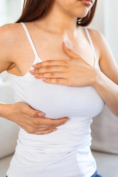 young-caucasian-woman-palpating-her-breast-by-herself-that-she-concern-about-breast-cancer-healthcare-breast-cancer-concept